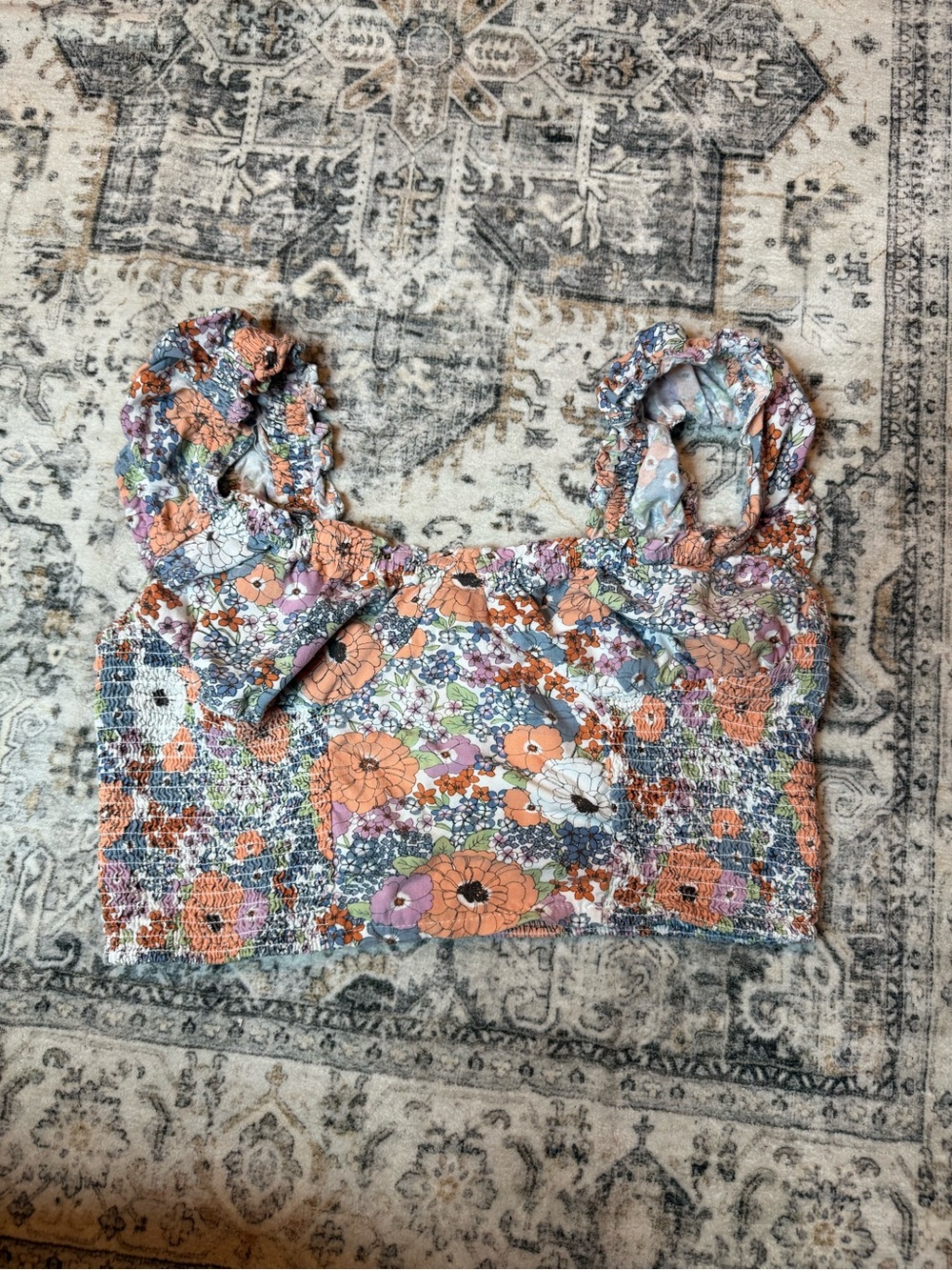 Japan floral print puff sleeve top with a smocked bodice.